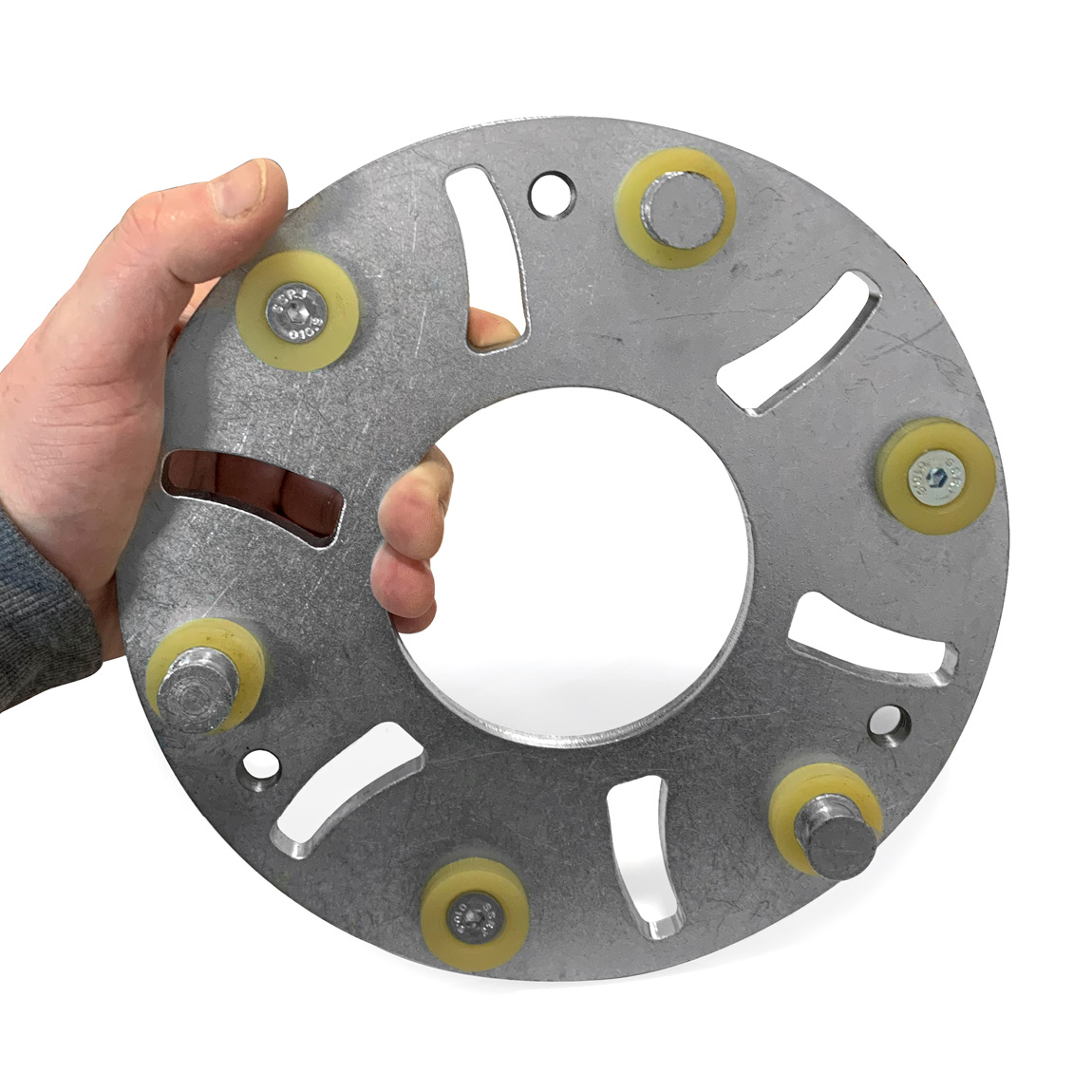 Grinding concrete abrasive holder for magnetic diamond grinding discs. This plate is designed to slot into the planetary arm plate system which can be attached to pedestrian and ride-on concrete trowels.