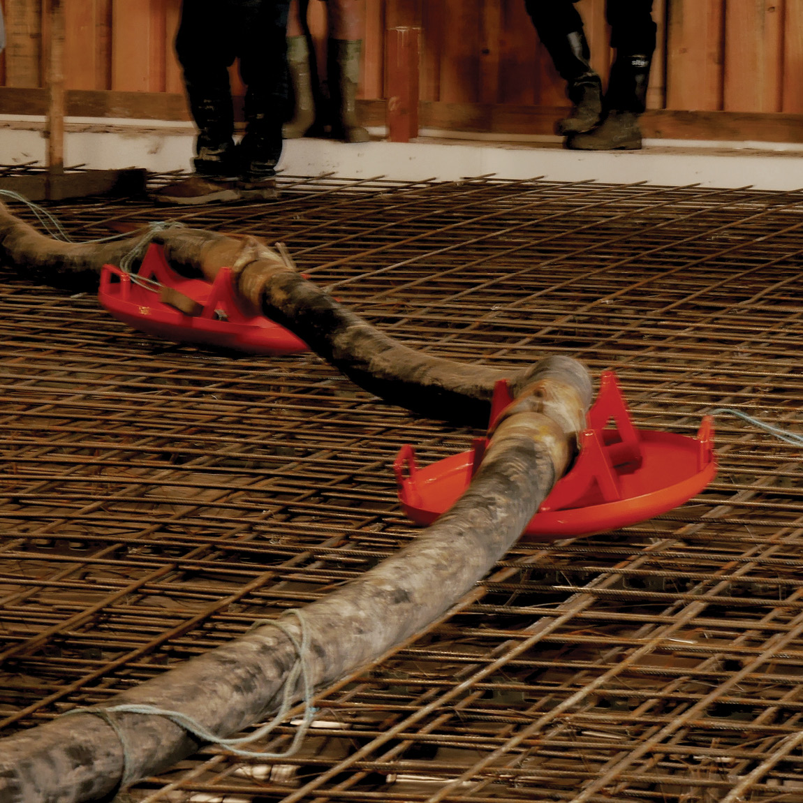 Concrete pump hose discs are used to ensure that concrete pours can be effectively managed on challenging surfaces. Speedcrete, United Kingdom Suppliers to the construction industry and concrete finishing innovators.