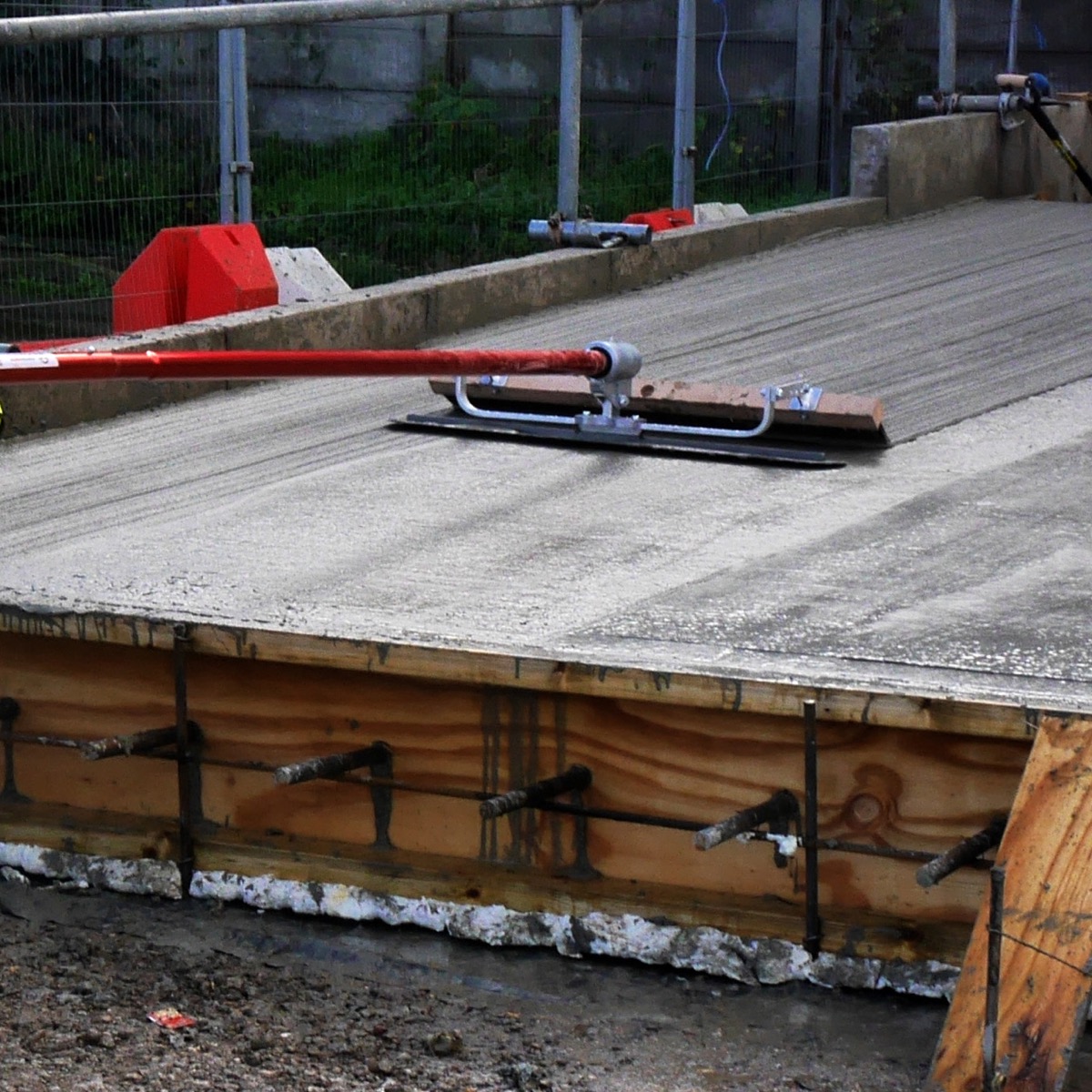 Steel 3 foot wide Fresno float and steel broom. Speedcrete, United Kingdom.